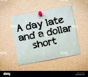 a-day-late-and-a-dollar-short-message-recycled-paper-note-pinned-on-EJWJCR.jpg